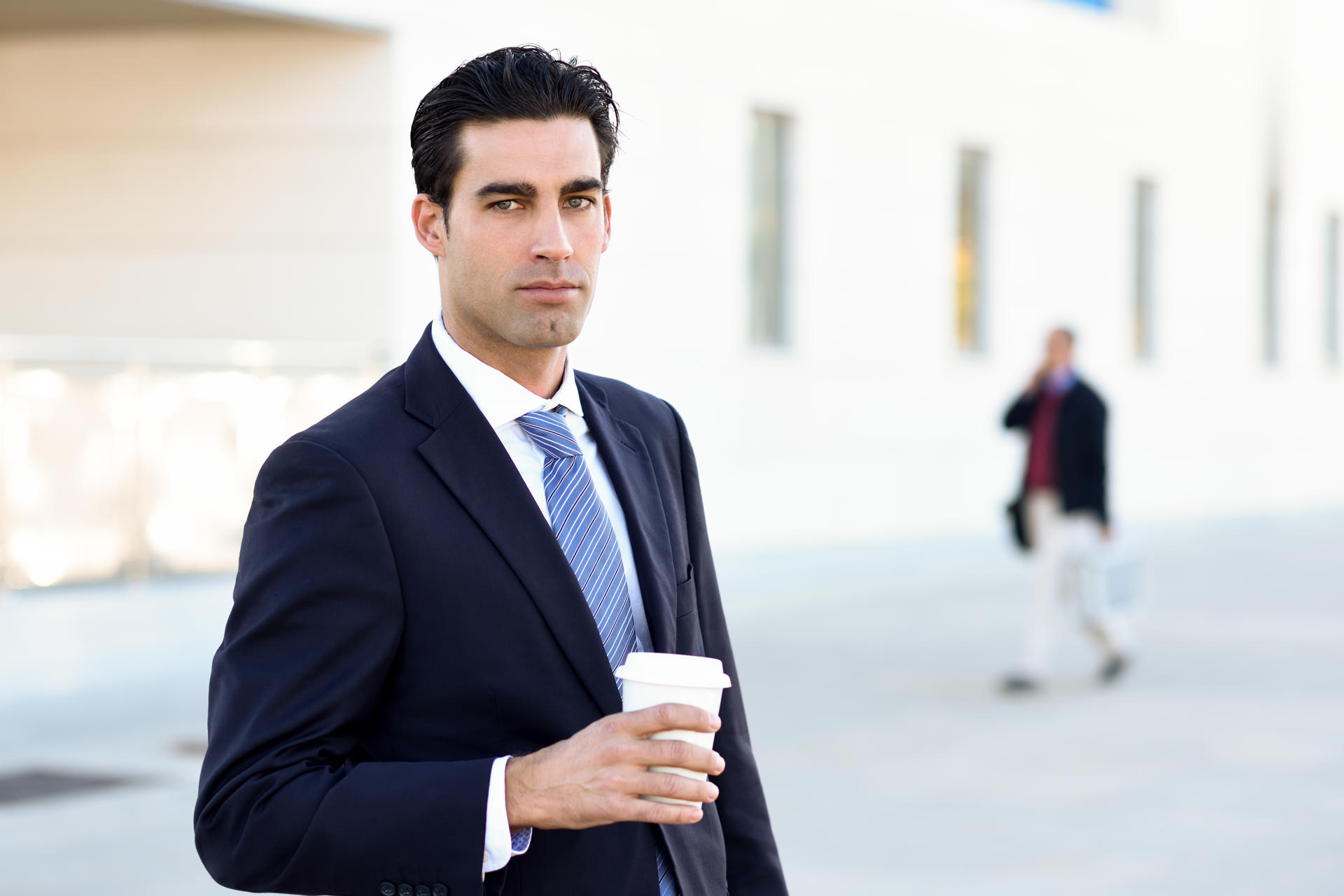 businessman-drinking-coffee-to-go-with-a-take-away-2025-03-25-09-14-06-utc.jpg